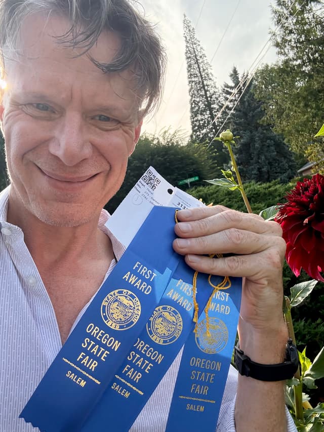 Peter with Oregon State Fair dahlia ribbons